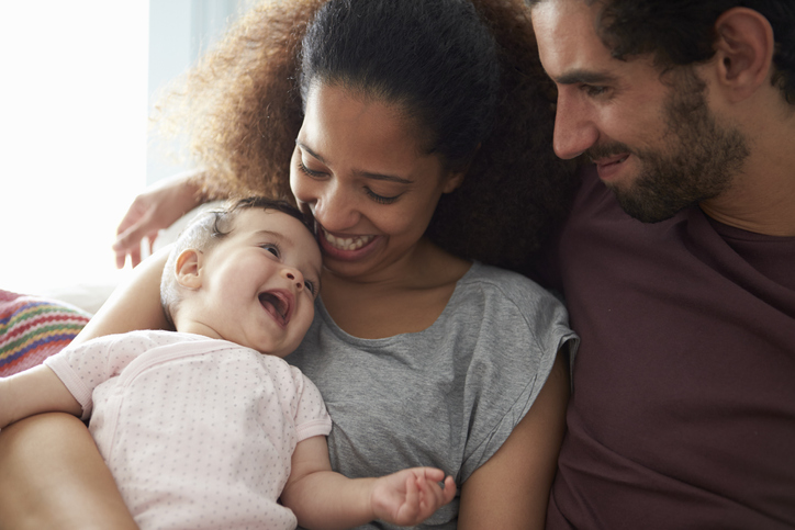 Parents with smiling baby